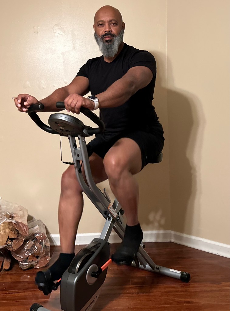 man over 40 on stationary bike