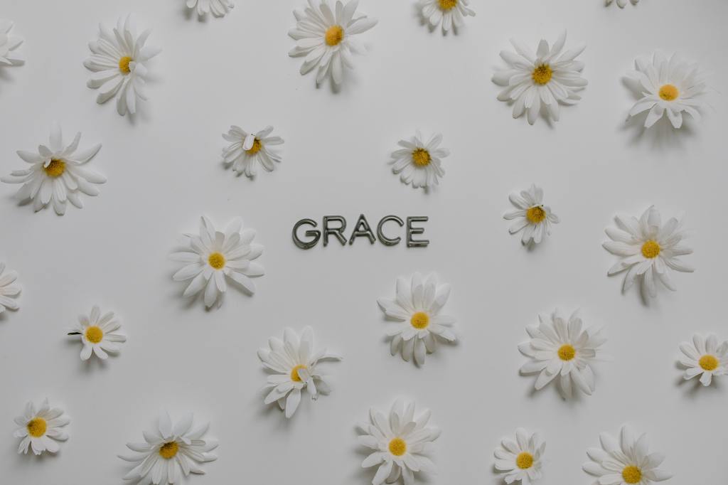 Daisies surrounding the word grace